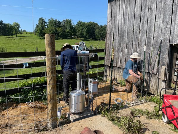 As part of KGS's FEMA Federal Emergency Management Agency-funded tornado-seismic project, Greg Steiner, Jon Schmidt, Seth Thompson (EES MS student), and Seth Carpenter installing seismic monitoring instrumentation at the Kentucky Seismic and Strong-Motion Network station in Sacramento, SMKY.